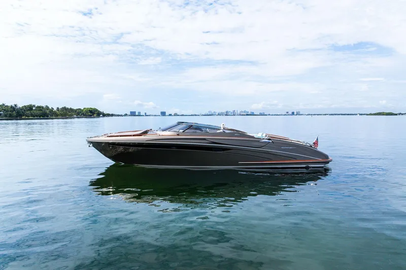 Slide: The Image of 2014 Riva Rivarama luxury yacht on calm water under a clear sky. - 4