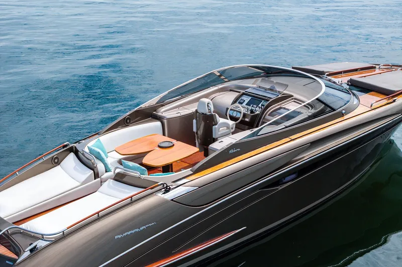 Slide: The Image of 2014 Riva Rivarama luxury yacht on calm blue water, featuring sleek design and elegant interior. - 8