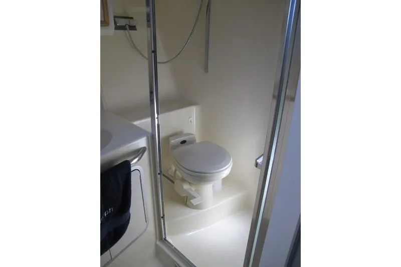 Slide: The Image of Bathroom interior of 1992 Sea Ray 370 Express Cruiser with shower and toilet. - 17