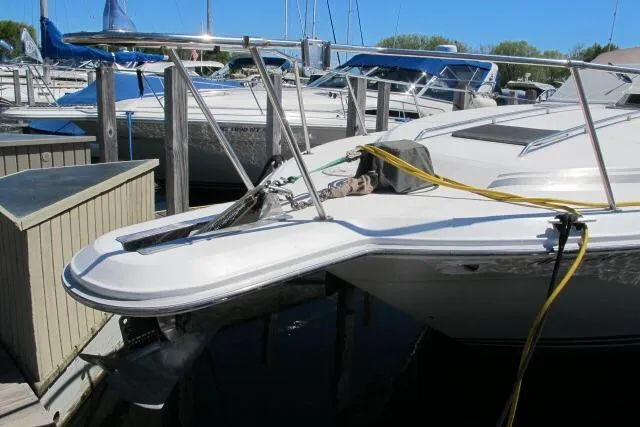 Slide: The Image of 1992 Sea Ray 370 Express Cruiser docked at marina with other boats. - 4