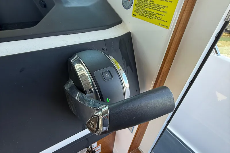 Slide: The Image of Simrad navigation screens on 2021 Axopar 28 WetBar boat dashboard. - 16