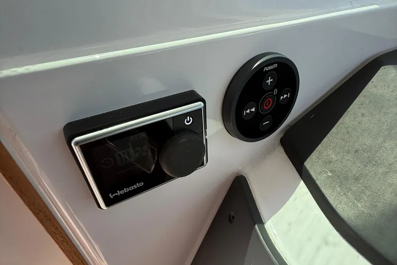 Slide: The Image of Simrad marine radio display on 2021 Axopar 28 WetBar boat, showing warning message. - 18