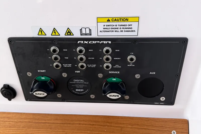 Slide: The Image of Control panel on 2021 Axopar 28 WetBar boat featuring Webasto and Fusion systems. - 19