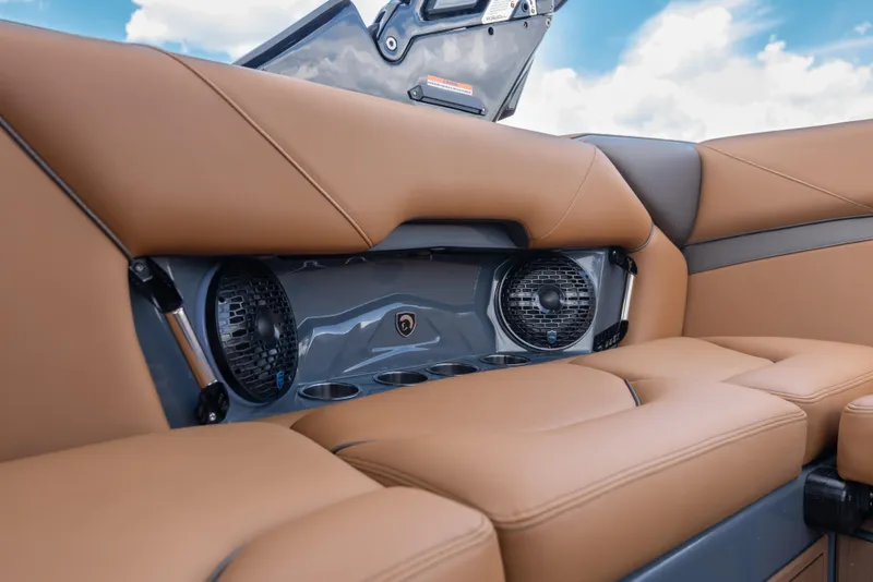 Slide: The Image of Luxurious interior of 2025 Centurion Nv233 boat with premium seating and integrated speakers. - 17