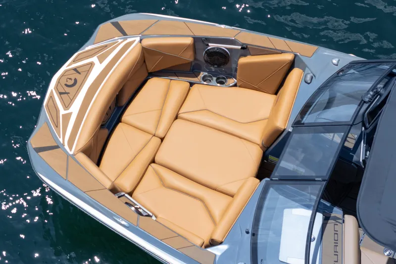 Slide: The Image of Luxurious seating on 2025 Centurion Nv233 boat, featuring tan upholstery and sleek design. - 21