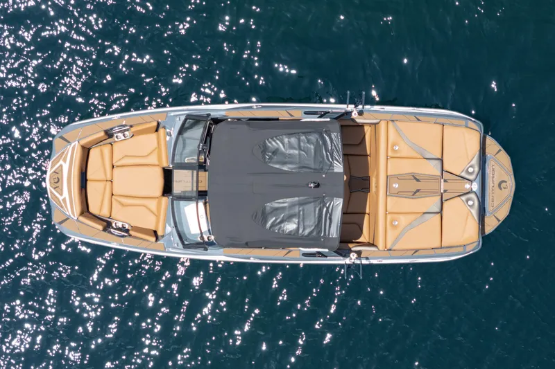 Slide: The Image of Overhead view of 2025 Centurion Nv233 boat on sparkling water. - 24