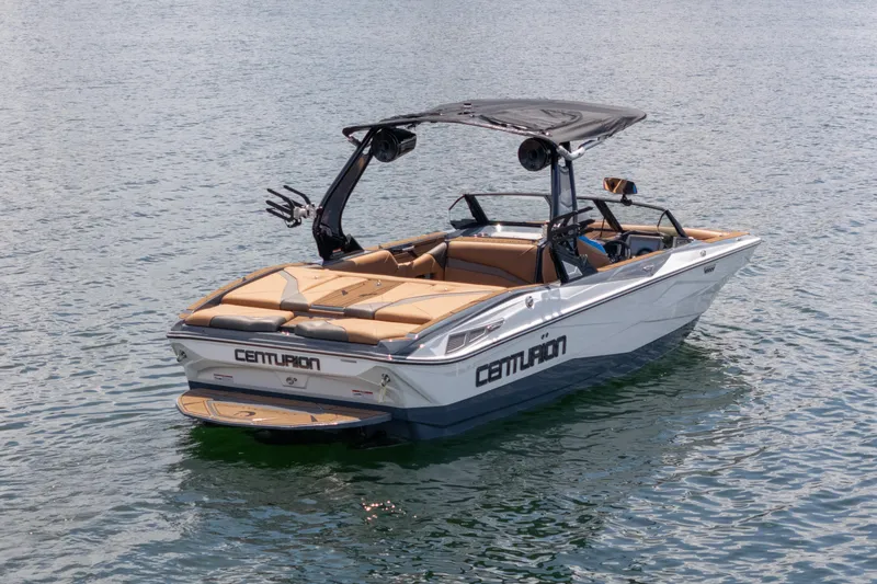 Slide: The Image of 2025 Centurion Nv233 boat on calm water, featuring sleek design and modern amenities. - 27