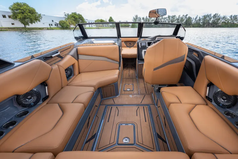 Slide: The Image of Luxurious interior of 2025 Centurion Nv233 boat with tan leather seating and modern design. - 3