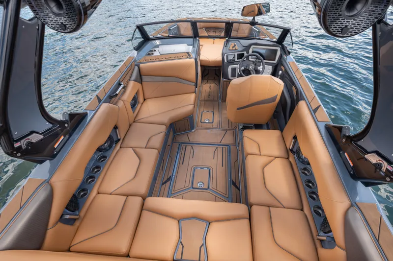 Slide: The Image of Luxurious interior of 2025 Centurion Nv233 boat with tan leather seating on water. - 4