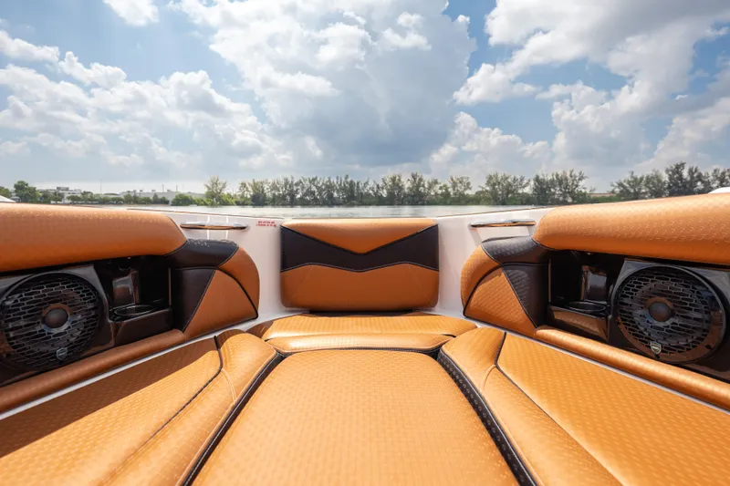 Slide: The Image of Luxurious interior of 2025 Supreme S220 boat with tan leather seating and speakers. - 14