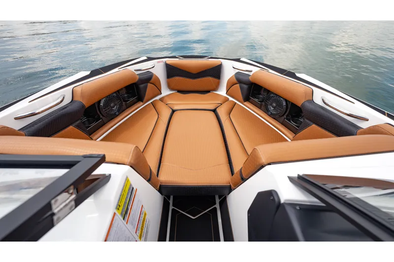 Slide: The Image of Luxurious interior of 2025 Supreme S220 boat with tan and black seating. - 15