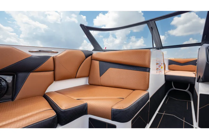 Slide: The Image of Luxurious interior of 2025 Supreme S220 boat with tan and black seating. - 17