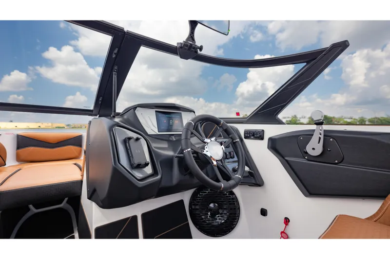 Slide: The Image of 2025 Supreme S220 boat interior with modern dashboard and steering wheel. - 18