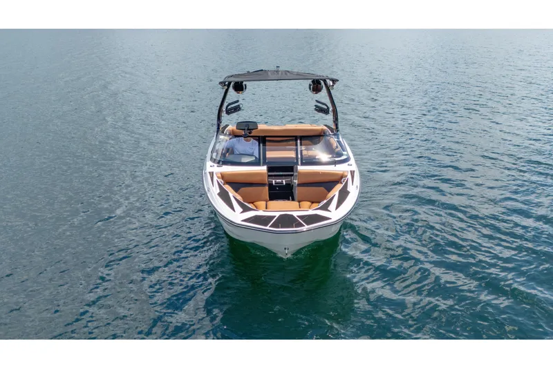 Slide: The Image of 2025 Supreme S220 boat on calm water, featuring sleek design and modern amenities. - 24