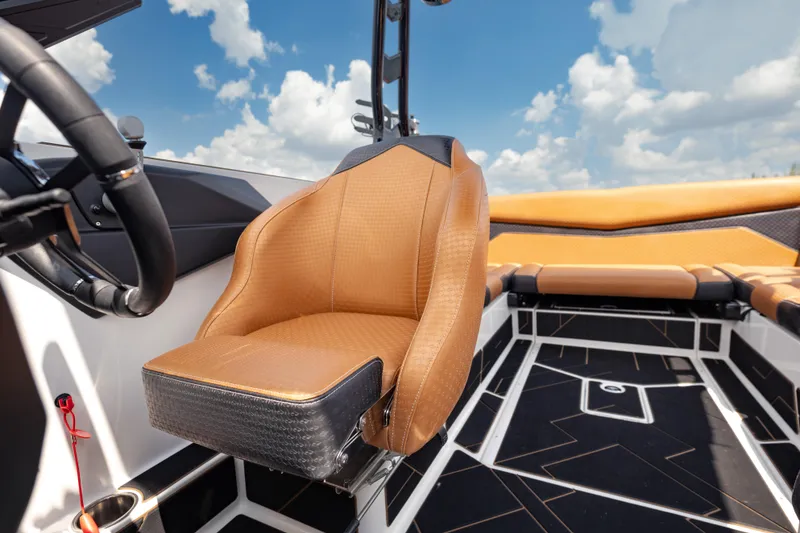 Slide: The Image of Interior of 2025 Supreme S220 boat with luxurious tan seating and modern design. - 7