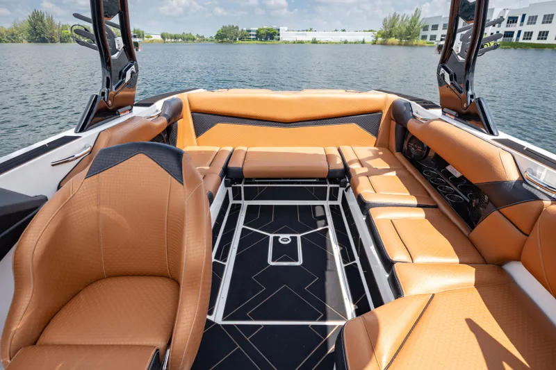 Slide: The Image of Luxurious interior of 2025 Supreme S220 boat with tan leather seating and modern design. - 9