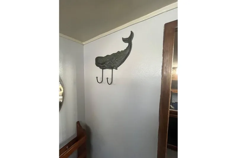 Slide: The Image of Wall-mounted whale hook on 1973 Uniflite Sport Fisher boat interior. - 100