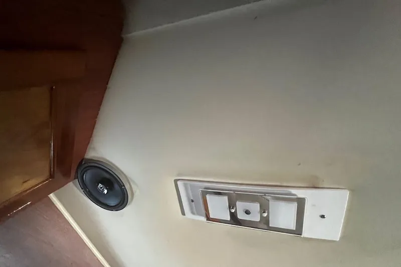 Slide: The Image of 1973 Uniflite Sport Fisher interior with speaker and control panel on wall. - 107