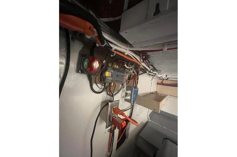 Slide: The Image of Electrical wiring and components inside a 1973 Uniflite Sport Fisher boat. - 115