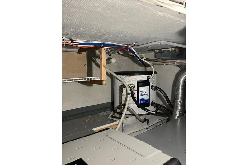 Slide: The Image of 1973 Uniflite Sport Fisher engine room with wiring and equipment. - 120