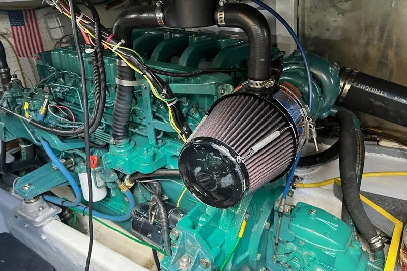 Slide: The Image of Engine of a 1973 Uniflite Sport Fisher boat, featuring detailed wiring and components. - 125