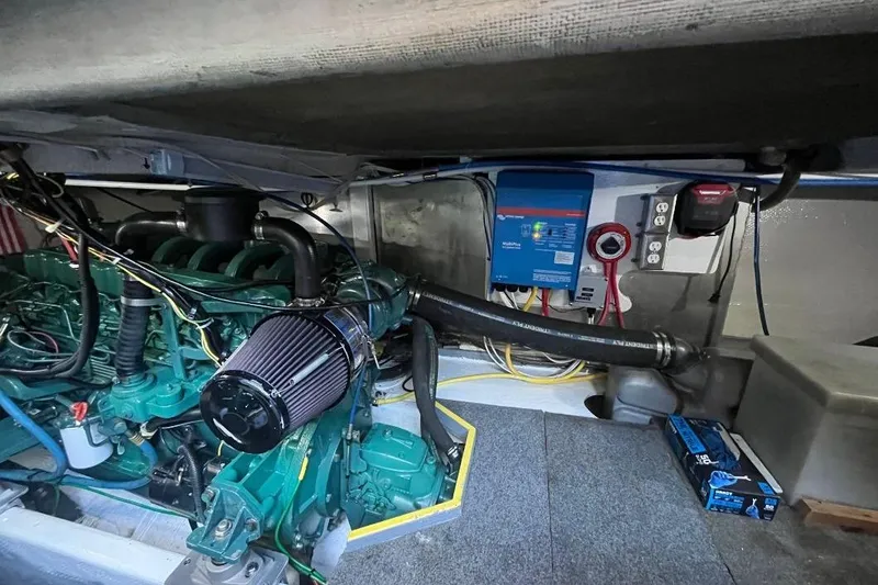 Slide: The Image of Engine room of a 1973 Uniflite Sport Fisher boat, showcasing mechanical components. - 131