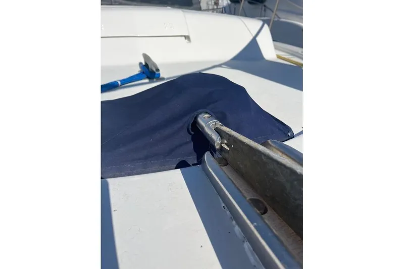 Slide: The Image of 1973 Uniflite Sport Fisher deck with blue cover and metal fittings. - 17