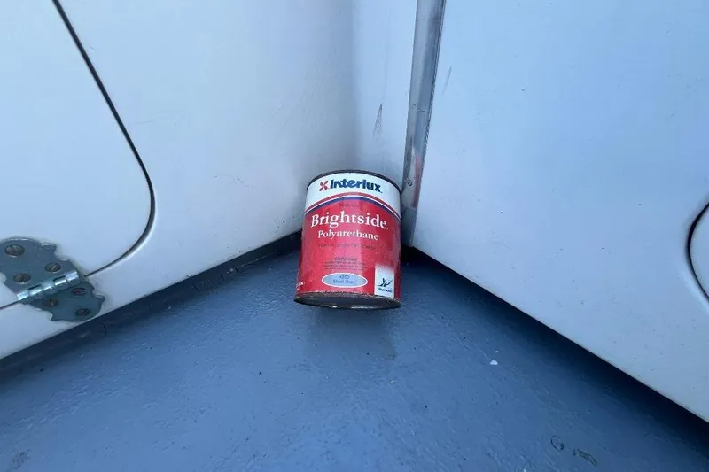 Slide: The Image of 1973 Uniflite Sport Fisher with Interlux Brightside polyurethane paint can on deck. - 26