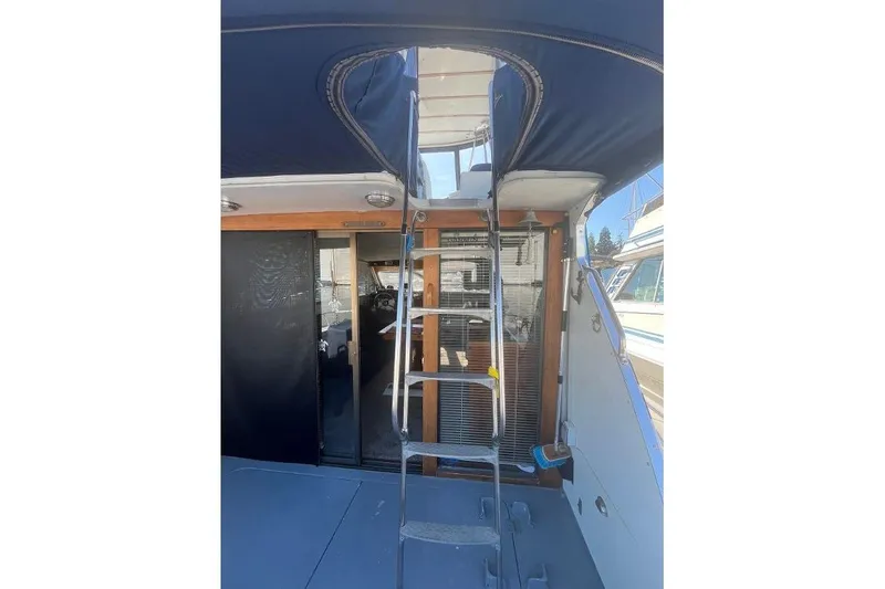 Slide: The Image of 1973 Uniflite Sport Fisher boat interior with ladder and sliding door. - 35