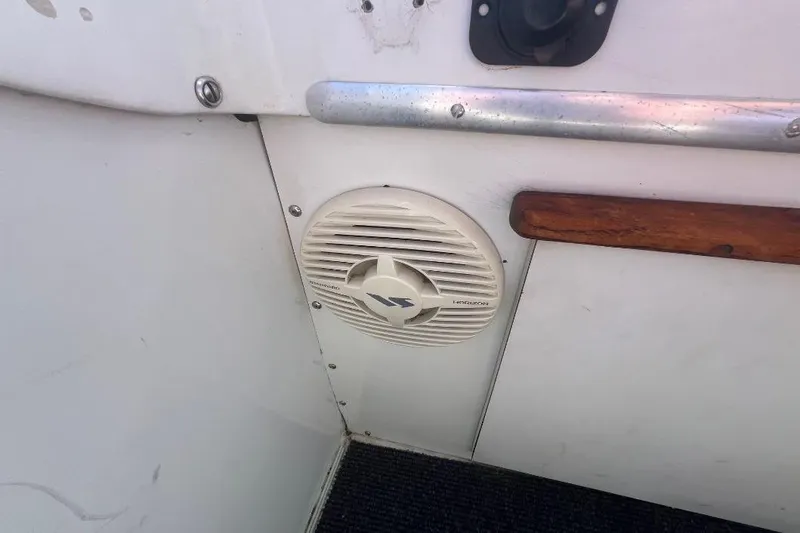 Slide: The Image of 1973 Uniflite Sport Fisher interior with marine speaker and wooden trim detail. - 43