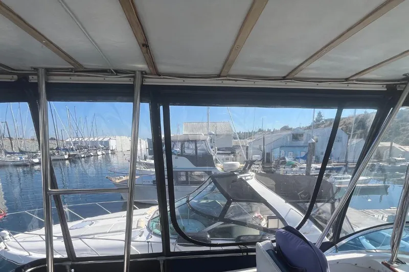 Slide: The Image of Interior view from a 1973 Uniflite Sport Fisher boat docked at a marina. - 44