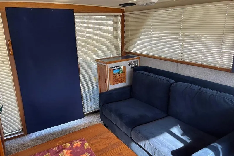 Slide: The Image of Interior of 1973 Uniflite Sport Fisher with blue sofa and blinds. - 68
