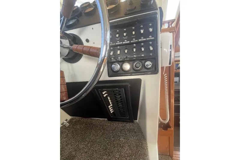 Slide: The Image of 1973 Uniflite Sport Fisher helm with steering wheel and control panel. - 72
