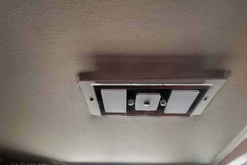 Slide: The Image of Ceiling light fixture inside a 1973 Uniflite Sport Fisher boat cabin. - 78