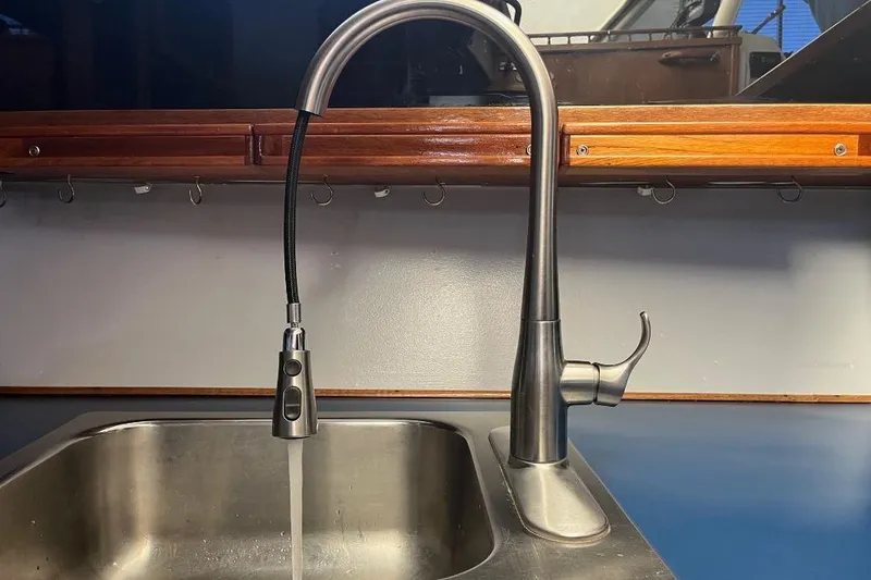 Slide: The Image of Stainless steel kitchen faucet on 1973 Uniflite Sport Fisher boat. - 83