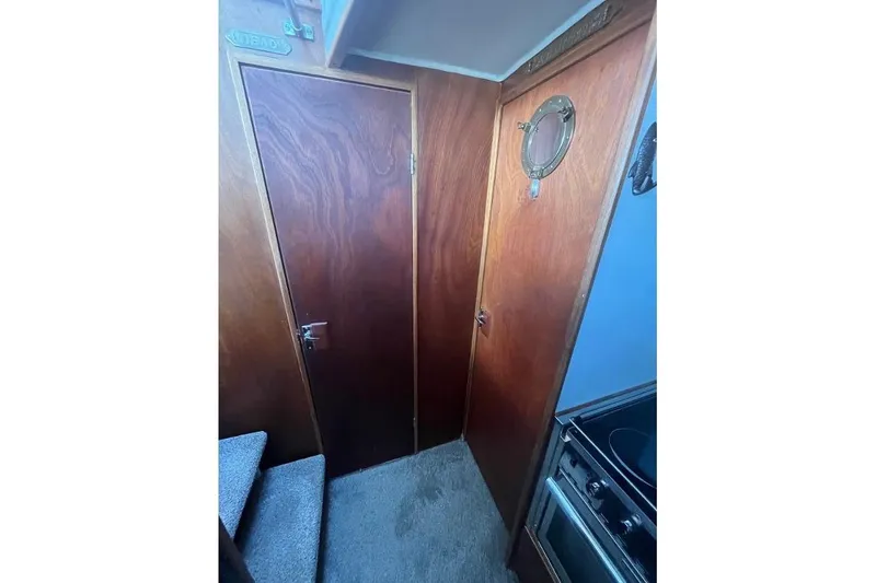 Slide: The Image of Interior of 1973 Uniflite Sport Fisher with wooden door and porthole. - 92