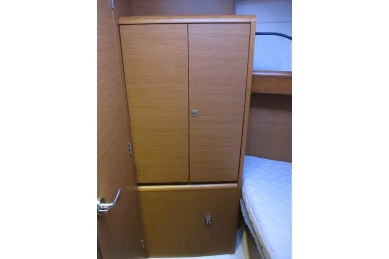 Slide: The Image of Interior cabin of 2013 Jeanneau 379 sailboat with wooden storage cabinet. - 16