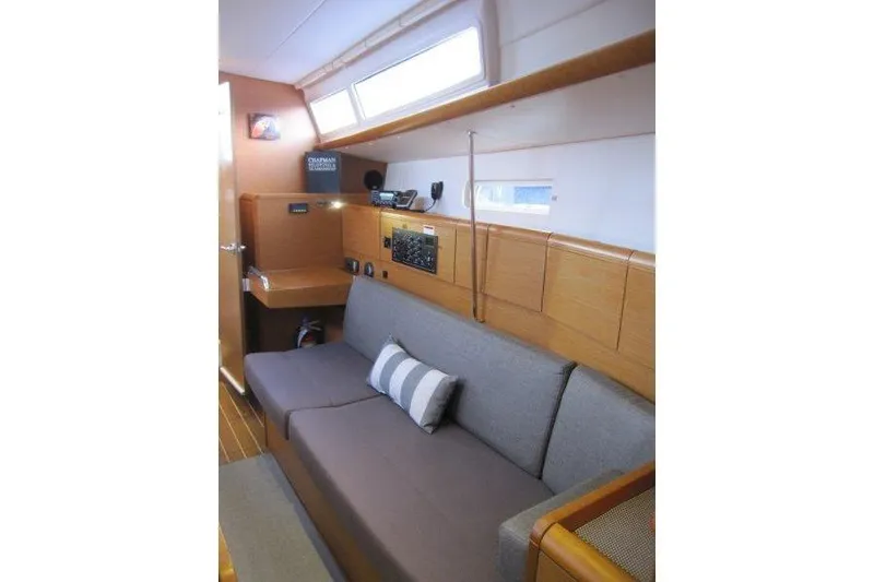 Slide: The Image of Interior of 2013 Jeanneau 379 sailboat with cozy seating and navigation equipment. - 17