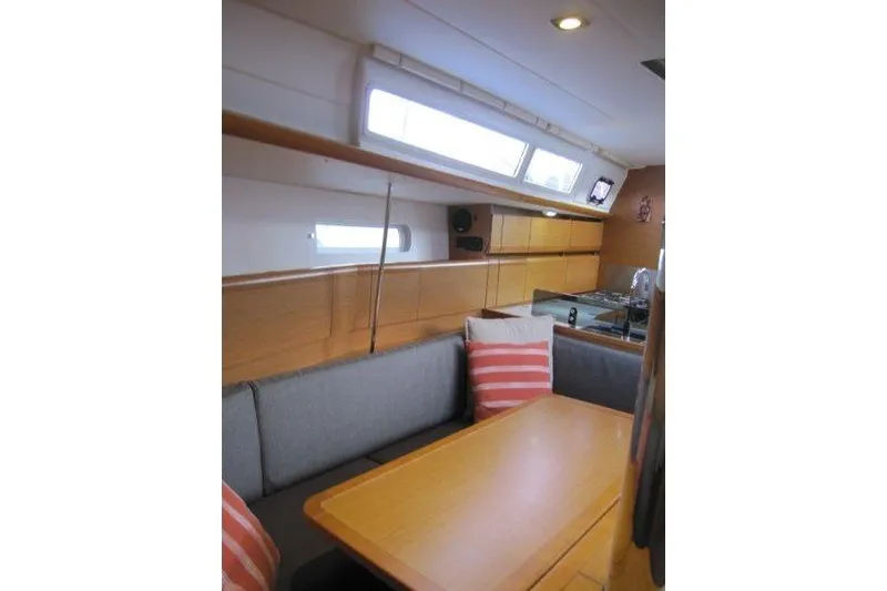 Slide: The Image of Interior of 2013 Jeanneau 379 sailboat with cozy seating and modern design. - 18