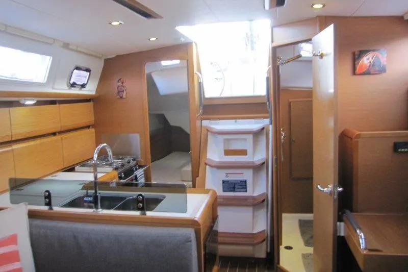 Slide: The Image of Interior of 2013 Jeanneau 379 sailboat with modern kitchen and cozy cabin space. - 19