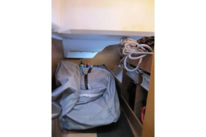 Slide: The Image of Storage area inside 2013 Jeanneau 379 sailboat with ropes and equipment. - 24