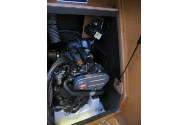 Slide: The Image of Engine compartment of a 2013 Jeanneau 379 sailboat, showcasing mechanical components. - 29