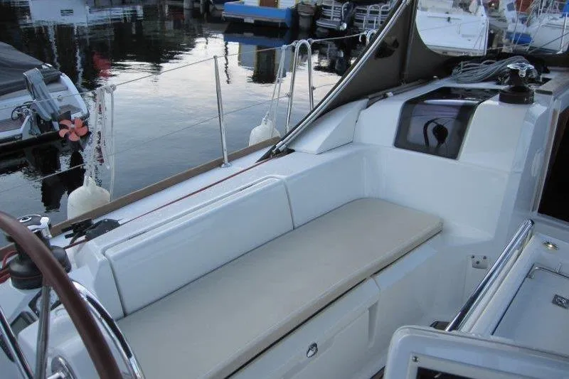 Slide: The Image of 2013 Jeanneau 379 sailboat cockpit with seating, docked at marina. - 36