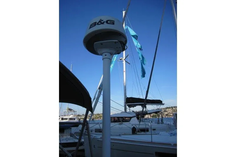 Slide: The Image of 2013 Jeanneau 379 sailboat with B&G equipment at marina, blue sky background. - 39