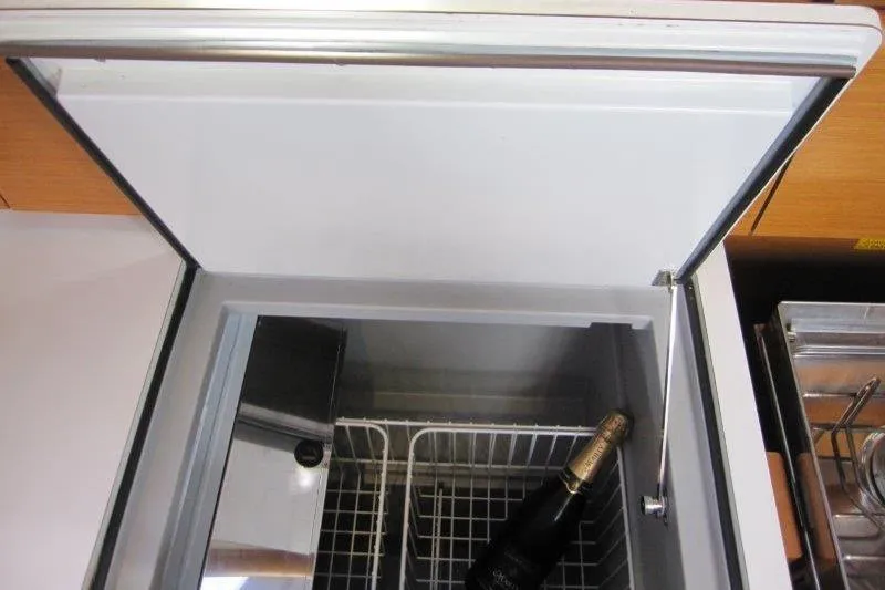 Slide: The Image of Open fridge on Jeanneau 379 yacht, 2013 model, with a bottle inside. - 8