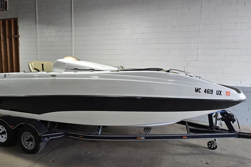 The Image of 2007 Sea-Doo Islandia SE boat on trailer in indoor storage. - 1