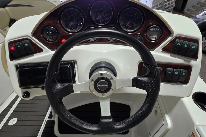 Slide: The Image of 2007 Sea-Doo Islandia SE dashboard with steering wheel and control panel. - 11