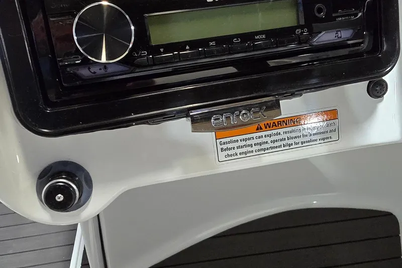 Slide: The Image of 2007 Sea-Doo Islandia SE dashboard with stereo and safety warning label. - 13