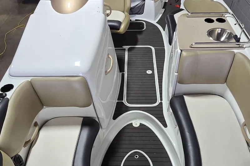 Slide: The Image of 2007 Sea-Doo Islandia SE boat interior with seating, sink, and storage compartments. - 14