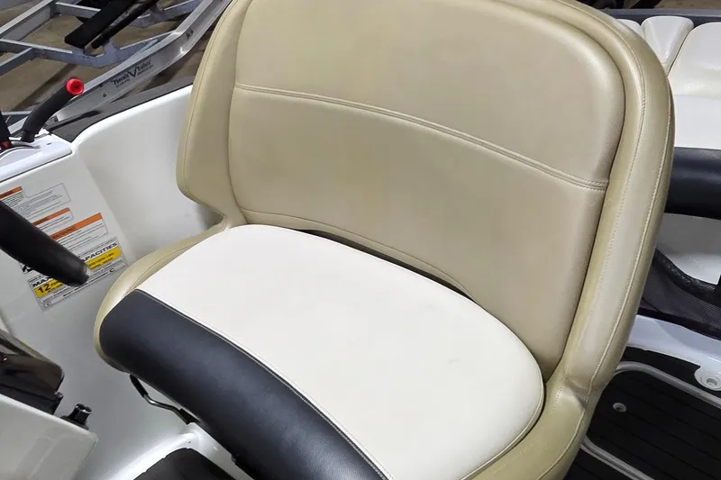 Slide: The Image of 2007 Sea-Doo Islandia SE boat seat with beige and black upholstery. - 17